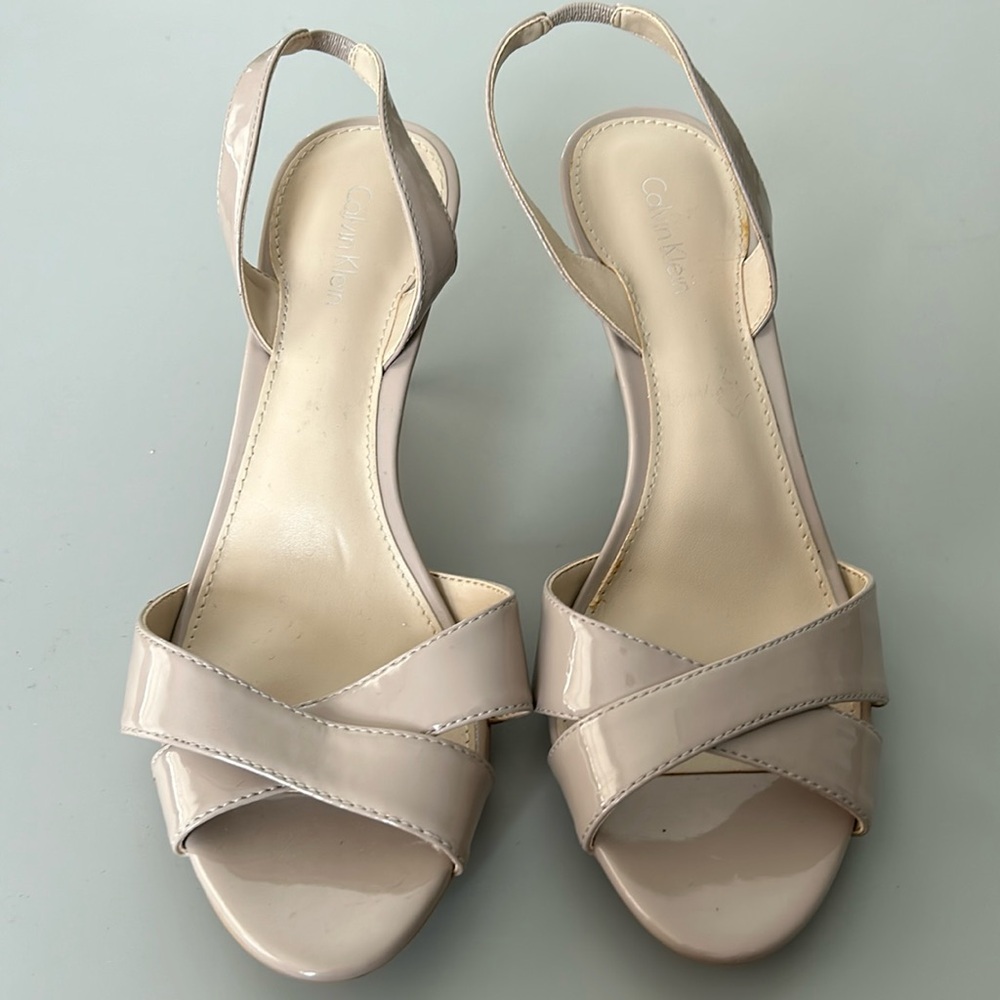 New Calvin Klein sandal/pumps in light tan patent. Size 9.. Heels 31/2 inches
